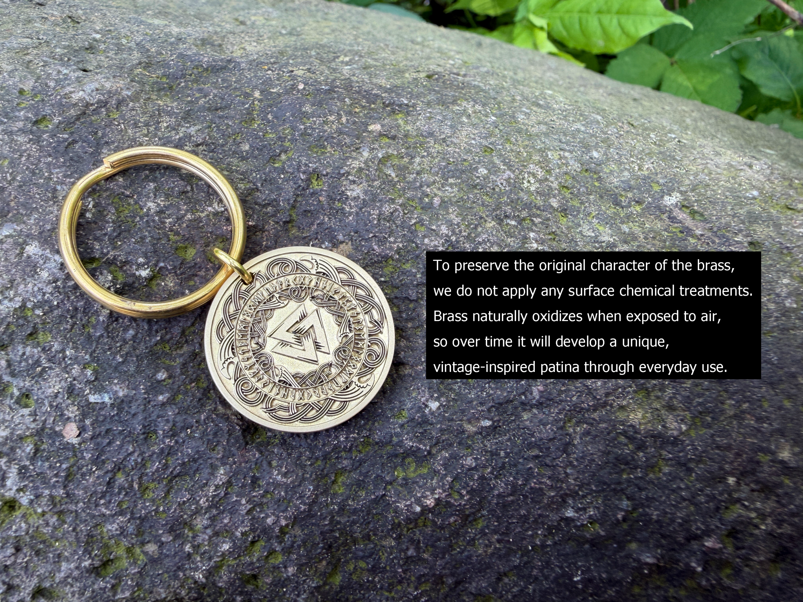 Brass keychain with Masonic square and compass engraving on rock, text detailing natural patina development process.