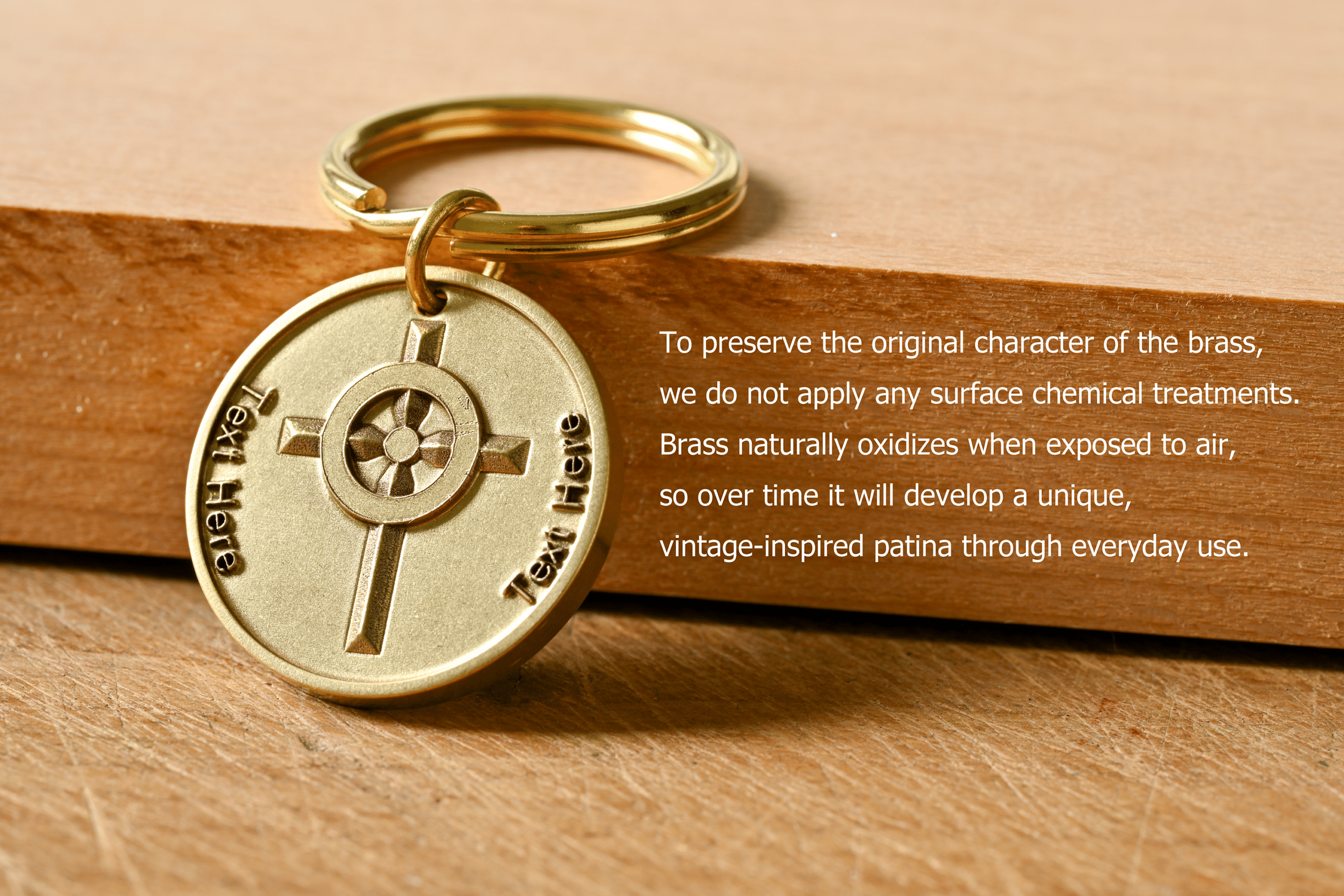 Brass keychain with a cross and Text Here engraving. Untreated brass naturally oxidizes to develop a unique patina over time