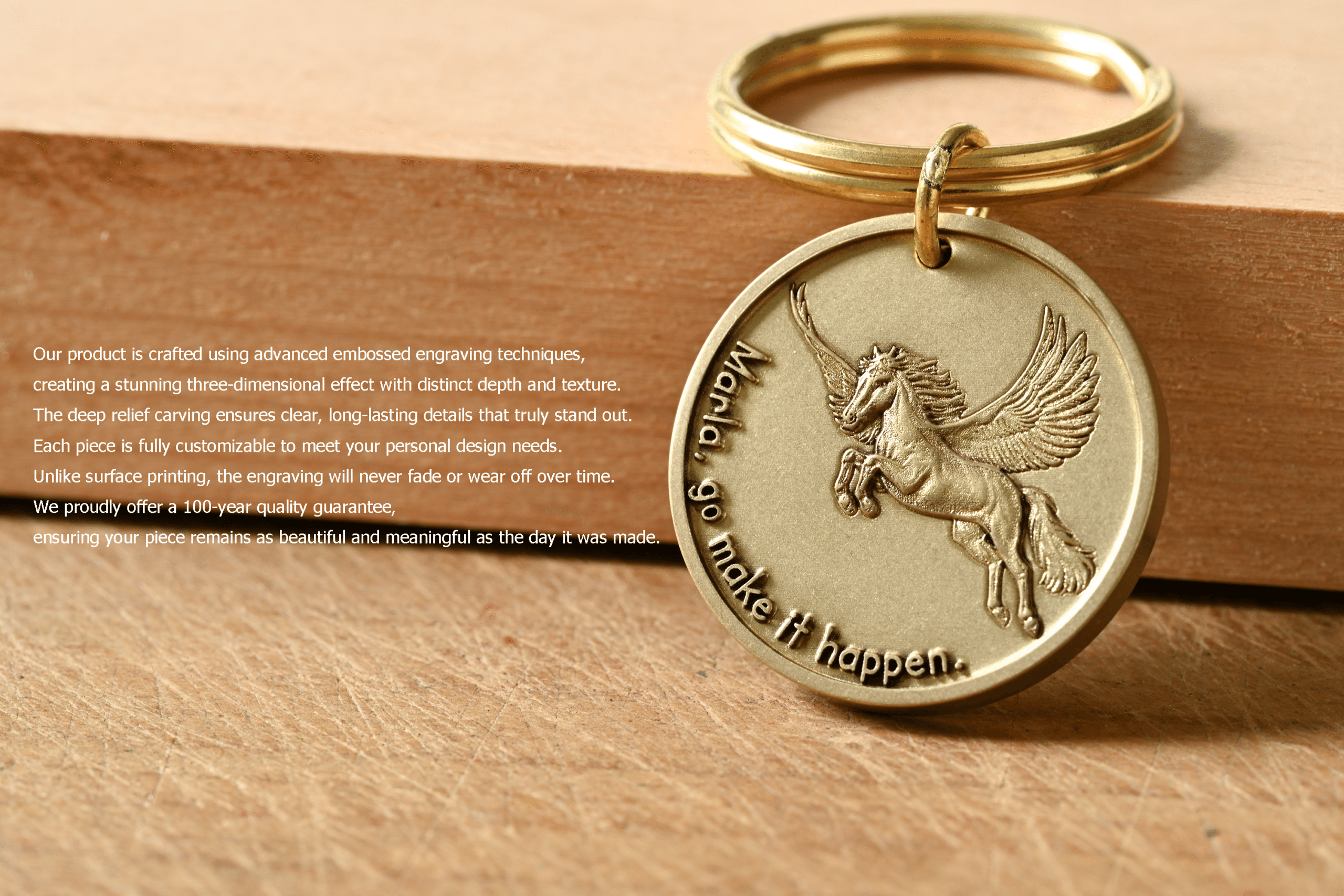 Gold keychain with embossed Pegasus and text: Marla, go make it happen. Text describes the 100-year quality guarantee