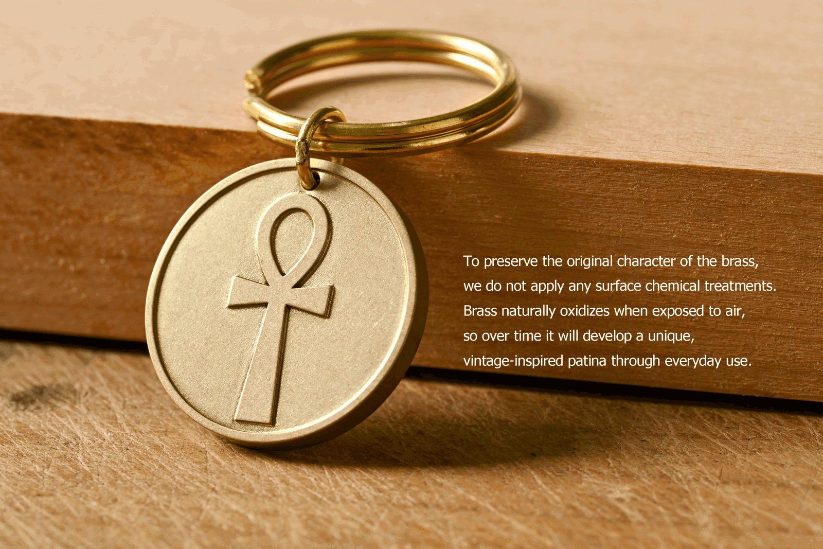 Brass keychain with an engraved Ankh symbol. To preserve the original character of the brass, we do not apply any surface chemical treatments. Brass naturally oxidizes when exposed to air, so over time it will develop a unique, vintage-inspired patina through everyday use